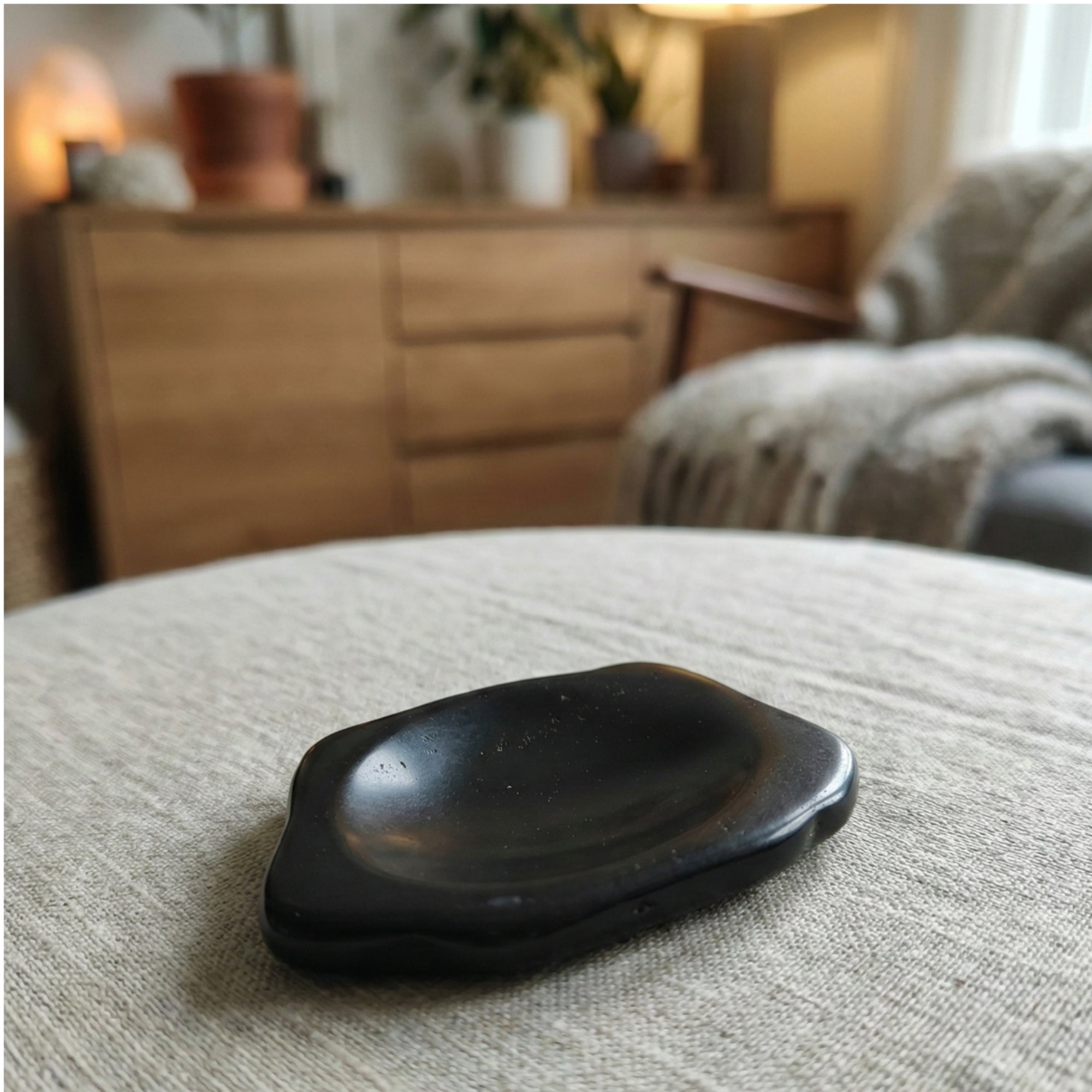 Buddy - Dog shaped crystal worry stone in Obsidian lay flat