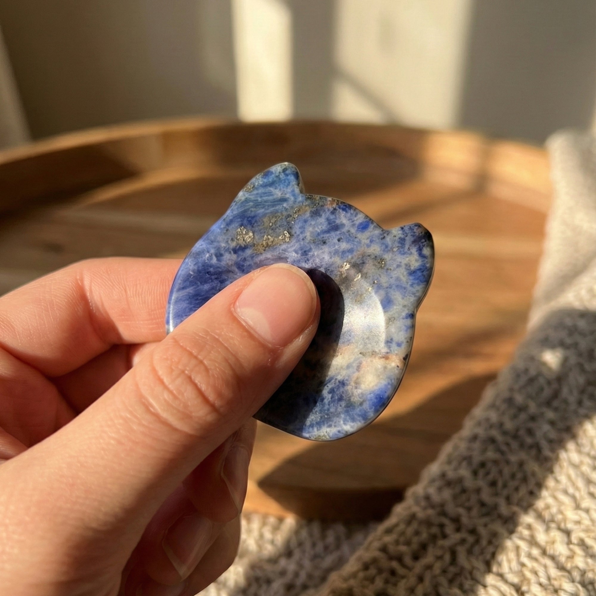Luna - Cat shaped crystal worry stone in Sodalite and rubbing with thumb